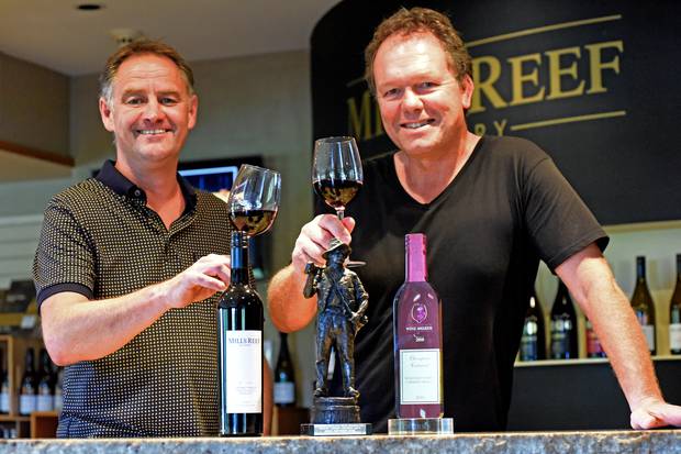 Senior winemaker Paul Dawick (left) and chief winemaker Tim Preston toast Mills Reef Winery's award at the Royal Easter Show Wine Awards. Photo / George Novak
