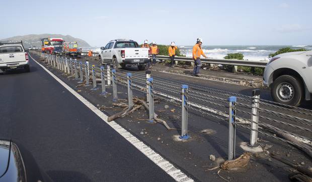 Debris, dumped by swells created by ex- Tropical Cyclone Gita, scattered over State Highway one between Paekakariki and Pukerua Bay. Photo / Mark Mitchell