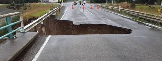 Raging floodwaters gouged a chunk out of Speechlys Bridge, between Fairlie and Geraldine, on State Highway79. Photo / NZTA
