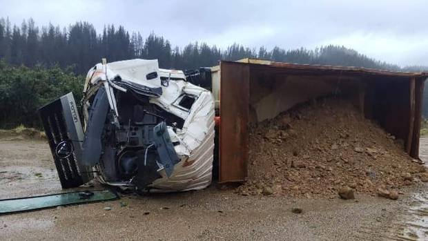 A truck and trailer at the mining site was pushed over and the cab smashed in. Photo / Supplied