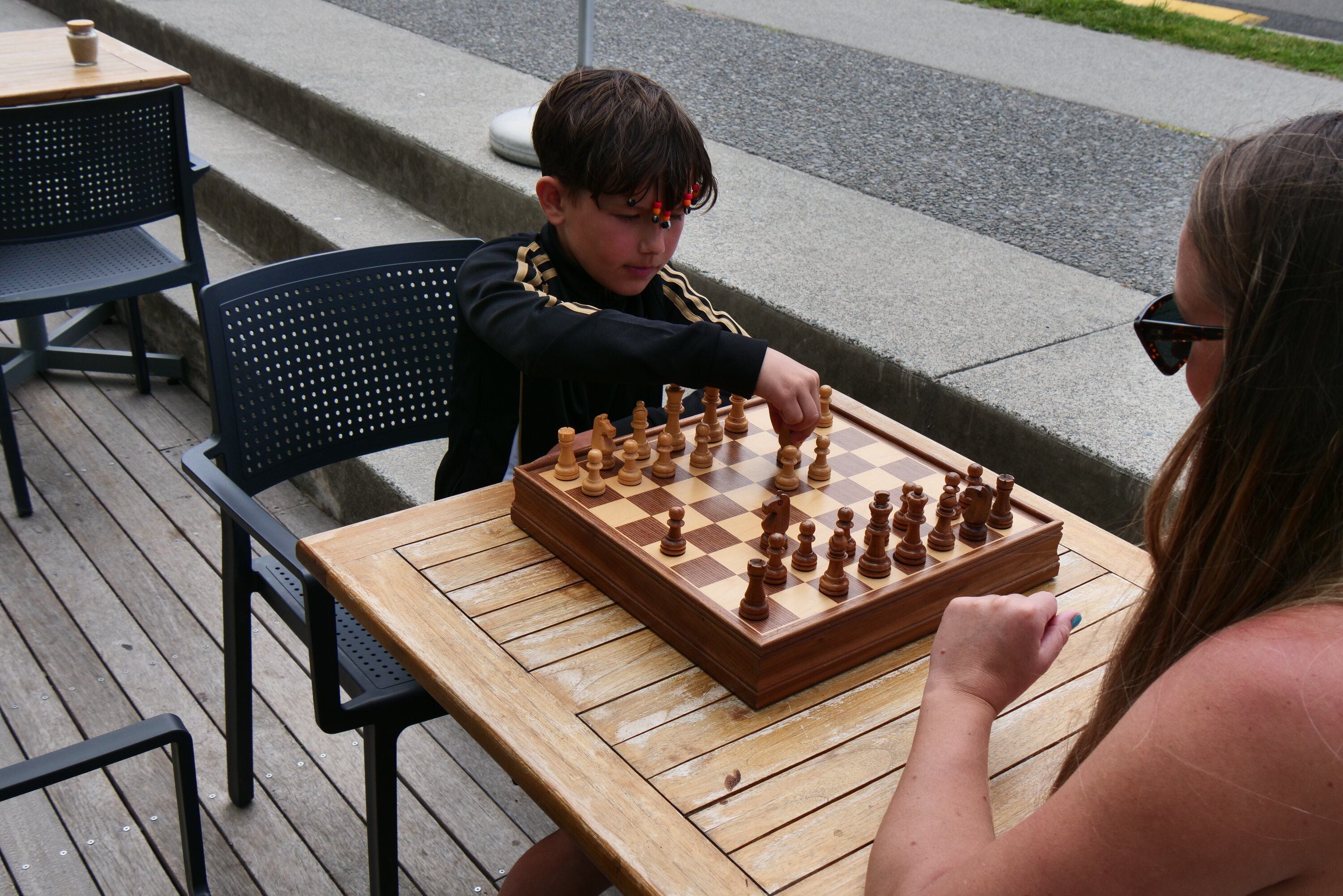 Alex Carter plays against his mother Kirsty Green at Tay Street Beach Cafe, in Mount Maunganui. Photo / Tom Eley