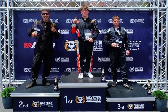 The podium for Round 3 of the Nexen Tyre NZ Mazda Racing North Island Series during the Alliance Services Hampton Downs International this weekend – first Mac Templeton of Prebbleton (middle), second Stuart Lawton of Paraparaumu (left) and third Rex Edwards of Tauranga (right). Photo: Geoff Ridder/Supplied