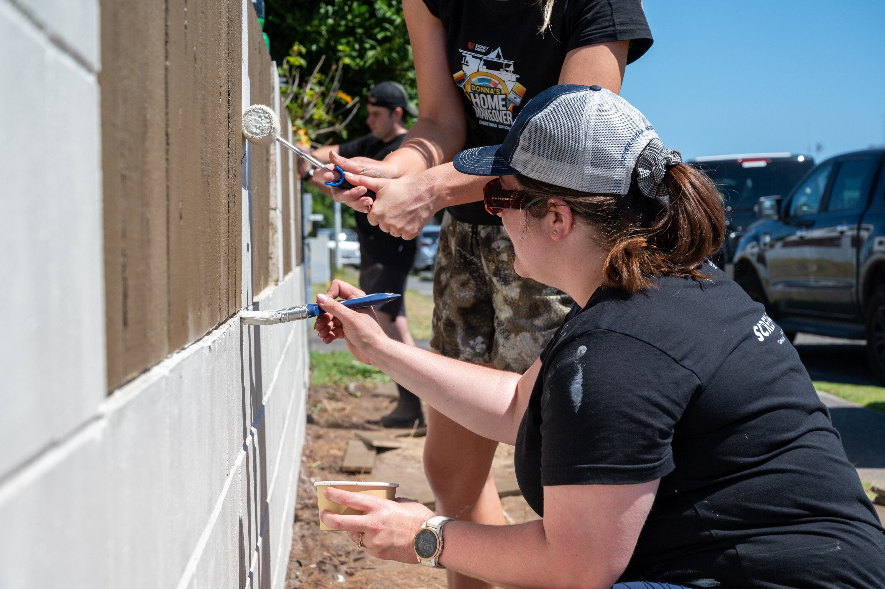 Members of the Stoney Creek crew painting the fence.