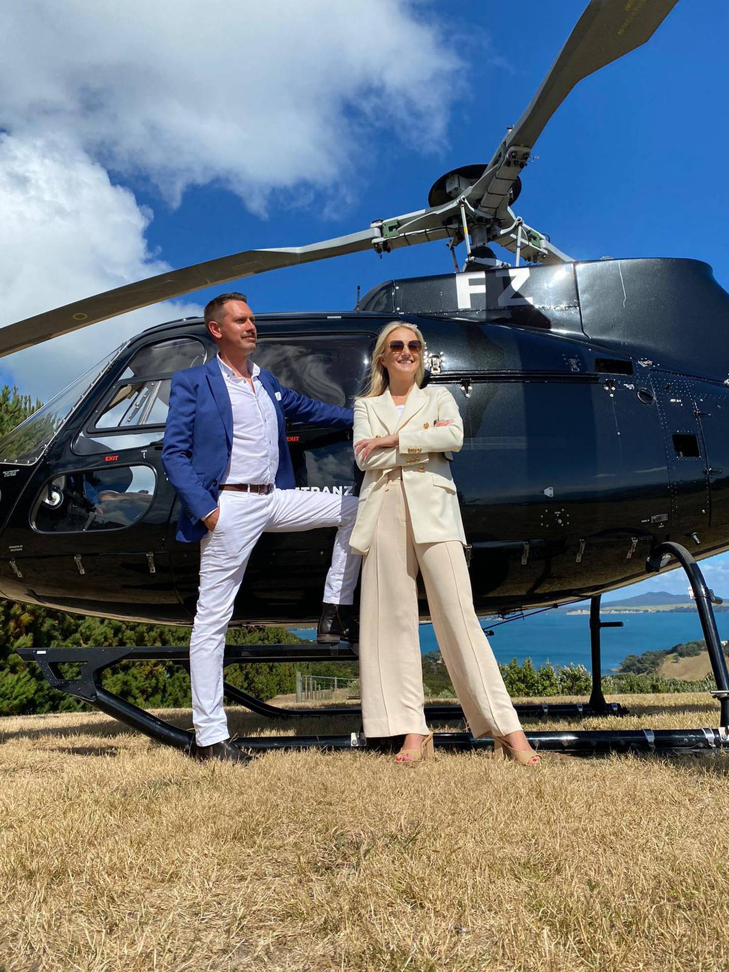 Agents Dave McCartney and Annabel Marshall fly to Waiheke Island to discuss the sale of a mansion with beautiful views over Auckland city. Photo / Supplied