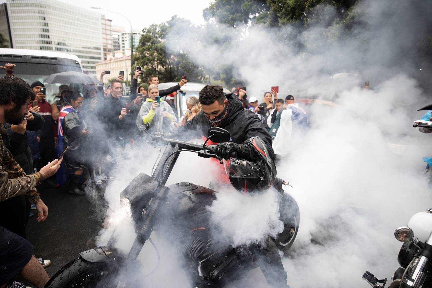 Protesters on motorbikes performed burnouts on the blocked-off streets surrounding Parliament. Photo / George Heard