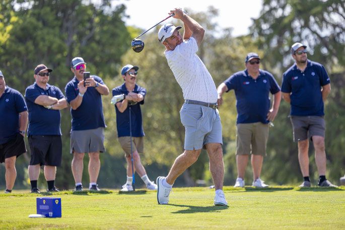 Tournament host Ryan Fox tees off in front of the Shimano team at The Fox on Saturday. Photo / Jamie Troughton/Dscribe Media