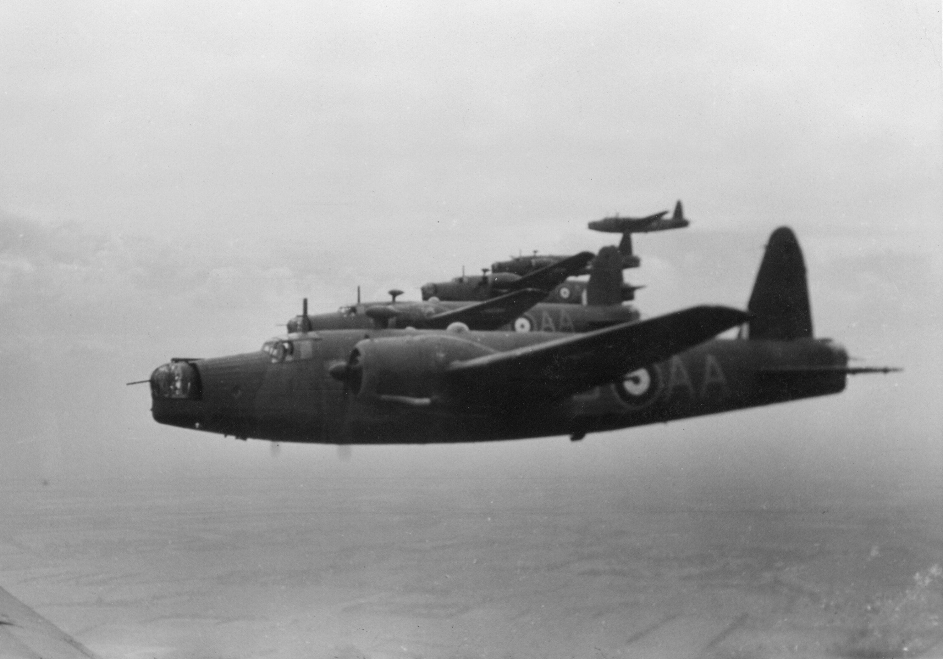 Air to air view of a flight of five No. 75 Squadron Wellingtons, unknown  location.
Photo / RNZAF Official Air Force Museum