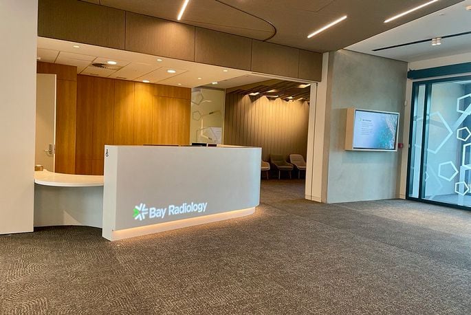 Bay Radiology's 17th Avenue reception area, the warm colour palette and soft materials reference the coastal environment of the Bay of Plenty. Supplied image