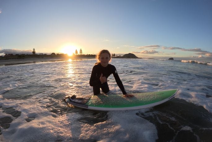 Millie Dyck about to paddle out in Mount Maunganui. Photo/Adam Dyck.