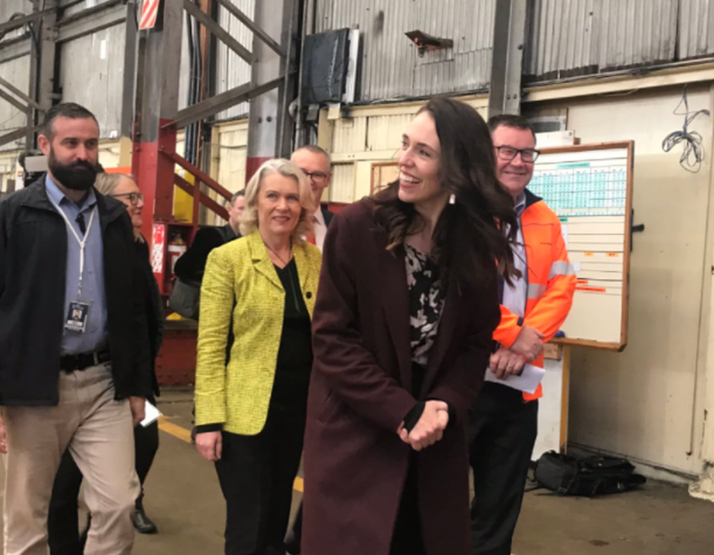 Prime Minister Jacinda Ardern (centre) was joined by Dunedin MPs Ingrid Leary and David Clark, and Finance Minister Grant Robertson during a visit to Hillside workshop. Photo / Daisy Hudson