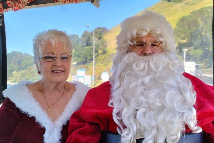 Santa and Mrs Claus enjoying a ride on the Pepi Toot Beach Express. Photo/David Hall.