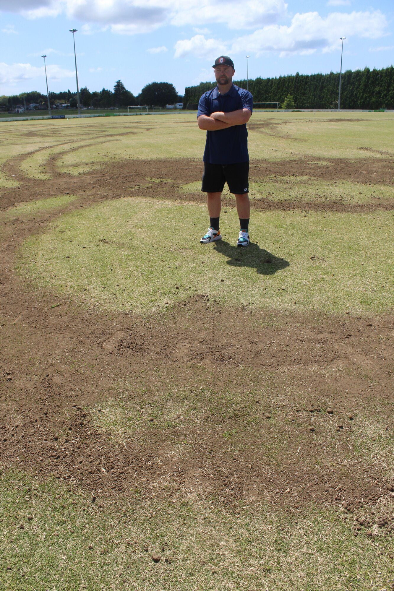  Brody Gilroy beside the grooves which have now been filled in with topsoil. Photo / Rebecca Mauger