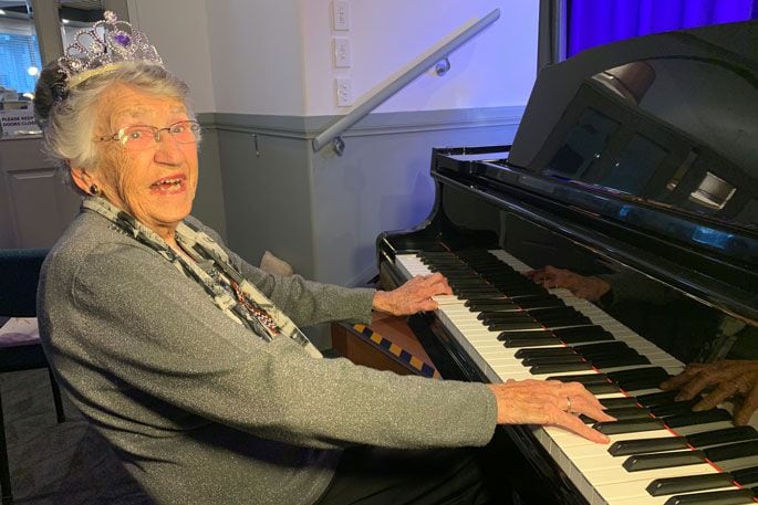 Coreen Gray playing piano at her 100th birthday celebration at Bayswater. Photo: Rosalie Liddle Crawford.