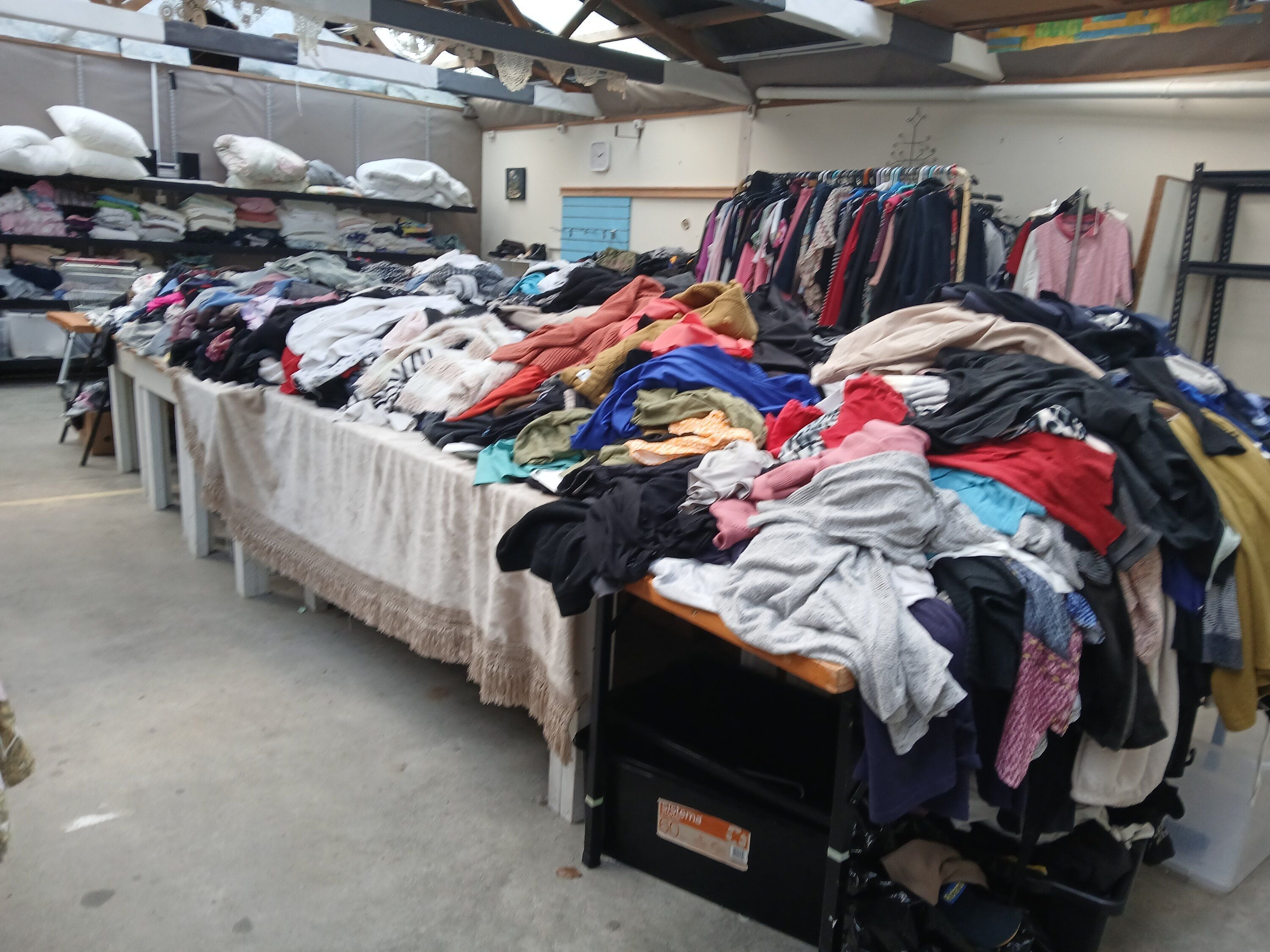 A mountain of clothing at Turning Point Recovery Services. Photo / Tom Eley