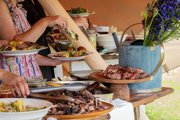 Every meeting includes a shared meal with attendees bringing food they have grown or raised. Photo: Sentient Imagery.