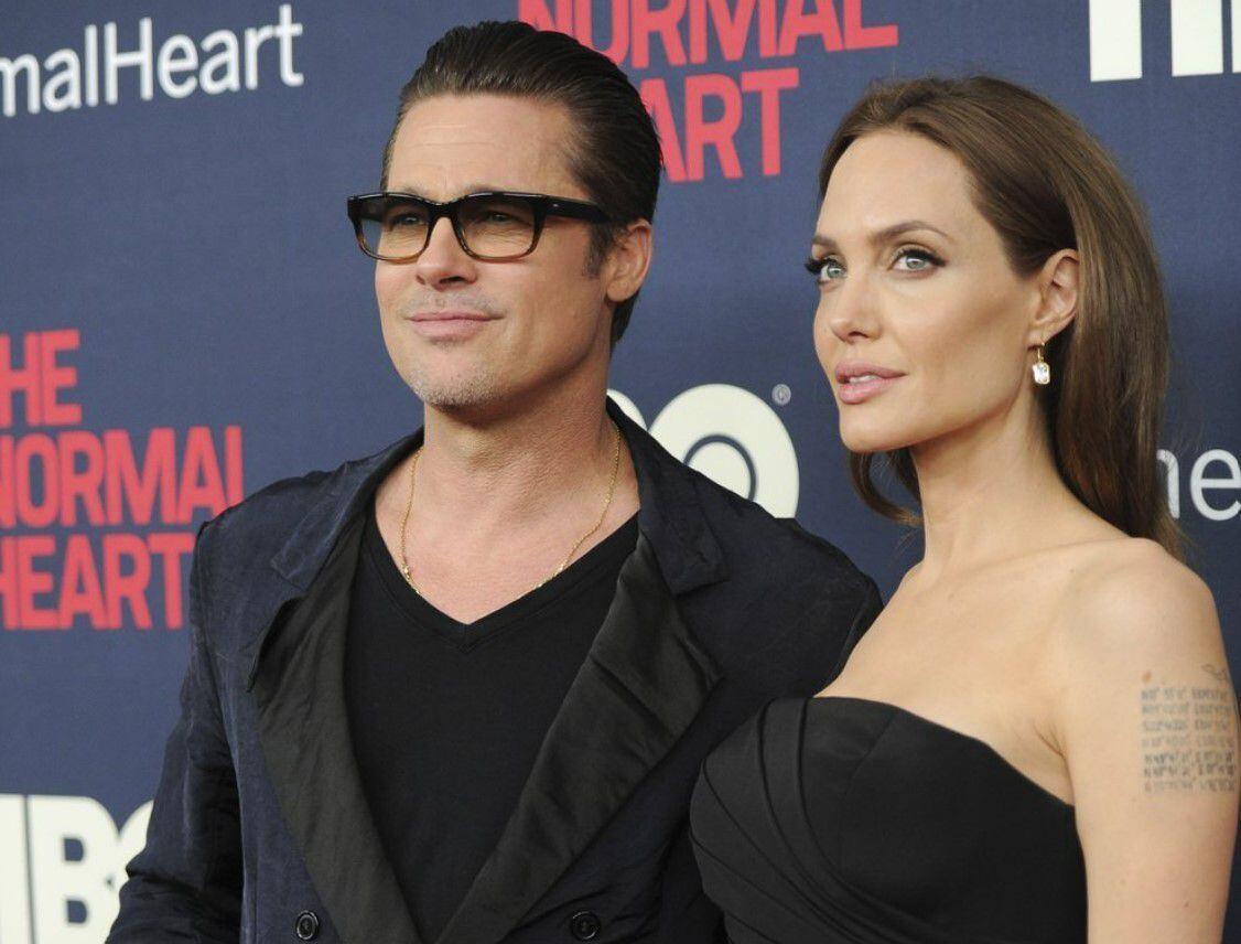 Angelina-Jolie-walked-through-airport-Brad-Pitt - eniGma Magazine