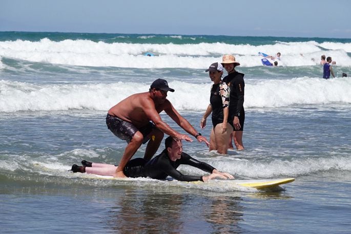 Lucas Pedersen from Parafed with Aiden Comrie, Waihi Beach Surf School. Photo: Ben Haarmann