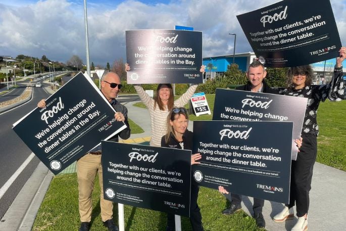 Tremains staff promote the “Selling for Food” initiative in Tauranga. Photo / John Borren