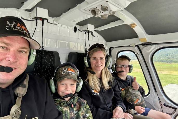 (From left): Jamie, Fletcher, Amie and James Fairbairn in a helicopter heading from Taupō to the Kaimanawa Range.