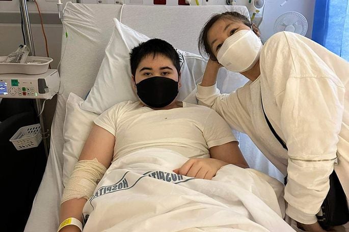 Daniel Patterson and his mum Apple Patterson in hospital in Tauranga. Photo / Supplied.