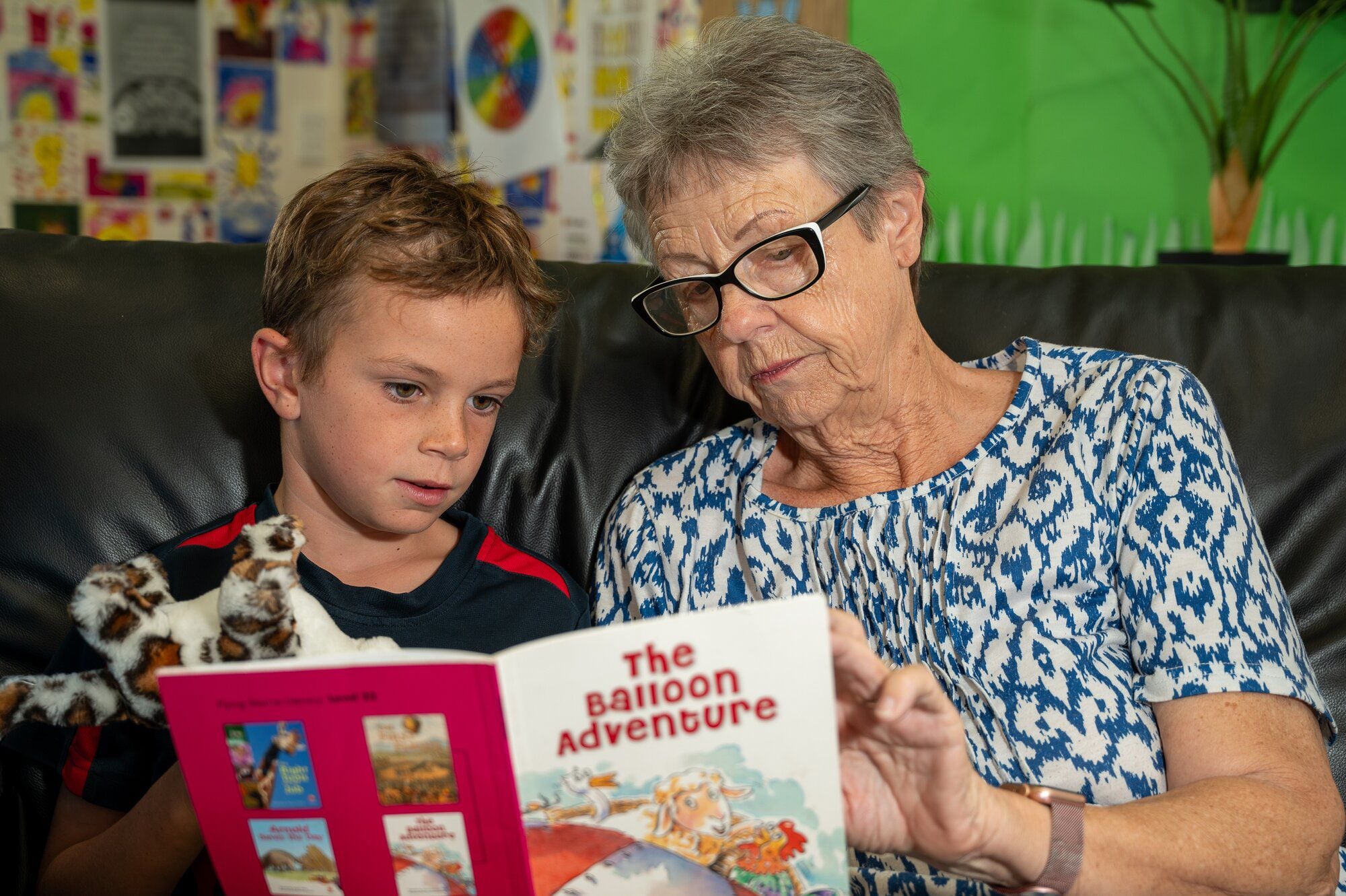  Ōmokoroa Point School Reading Mileage Programme student Reef Bowker, 7, and tutor Val Barmes. Photo / David Hall