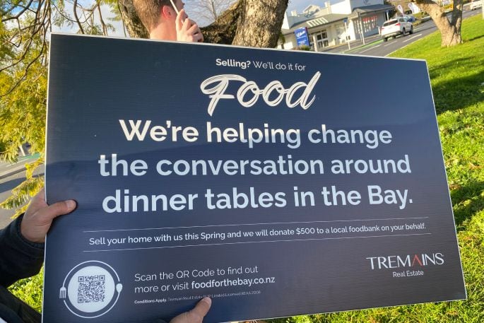 Tremains staff promote the “Selling for Food” initiative along Cameron Rd outside their offices. Photo / Ayla Yeoman