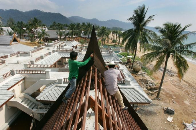 Workers construct new buildings (the old buildings were destroyed by the tsunami) at the Mukdara Beach Resort at Khao Lok, Phang Nga District in Thailand's south, after the region was hit hard by the Boxing Day Tsunami 2004. Photo/ Brett Phibbs.