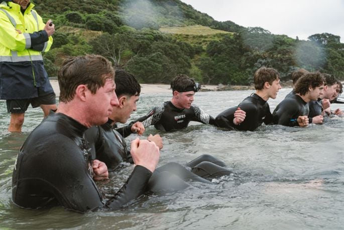 Tauranga MP Sam Uffindell and the Tauranga Boys' College prefects during the surf torture session. Photo / Supplied