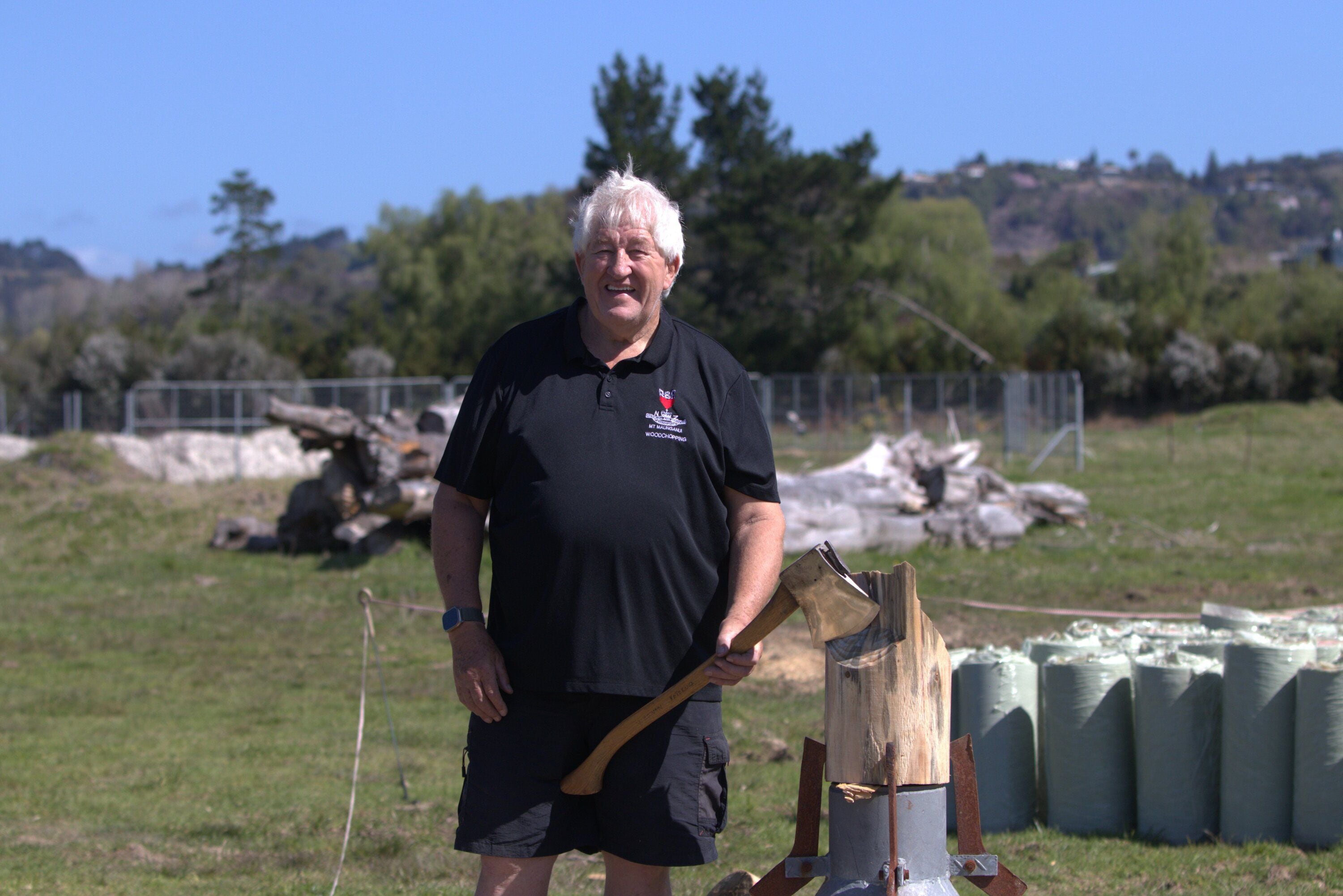 Neville Bowen shows off a training axe ahead of the woodchopping event at the Mount Maunganui RSA. Photo / Bob Tulloch