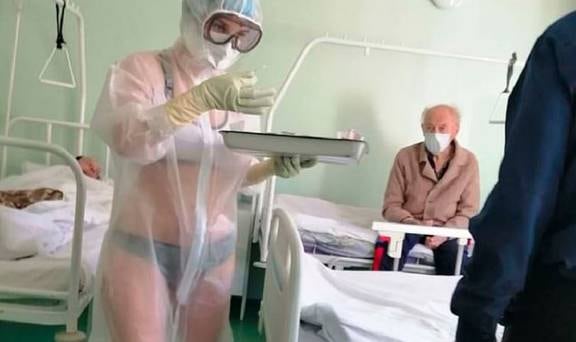 Covid 19 coronavirus: Nurse suspended for wearing just underwear under  see-through PPE gown - NZ Herald