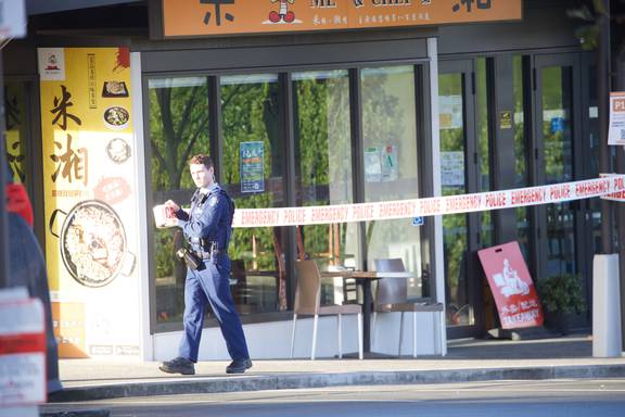 A police officer at the scene of the attack in Albany, Auckland, this morning. Photo / Jason Oxenham