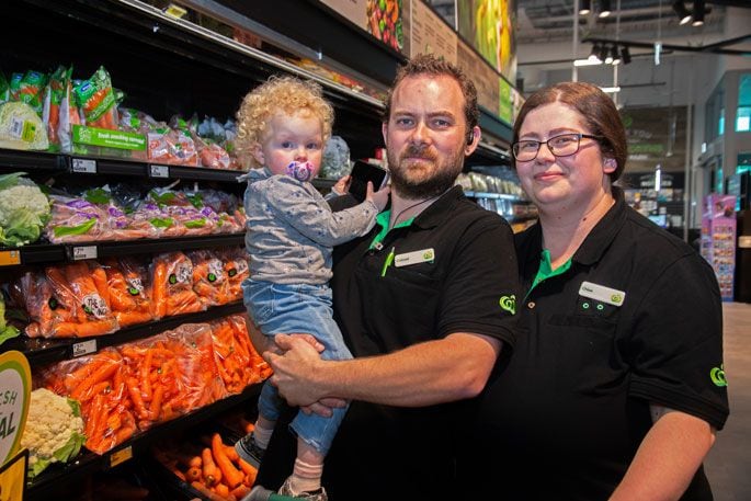 Conrad Moroney and Chloe Walker have both worked at Bureta Park Woolworths for 10 years, found love in the aisle in 2017, and now have daughter Charlotte together. Photo: Bob Tulloch.