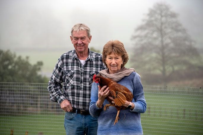 Ray and Mary Hooker with one of their chickens. Photo: Catherine Fry