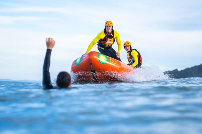 Surf Life Saving New Zealand lifeguards using an Inflatable Rescue Boat (IRB). Photo / SLSNZ