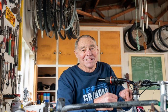 Lex Spencer fixing a bike in his Maungatapu shed. Photo/ Brydie Thompson.