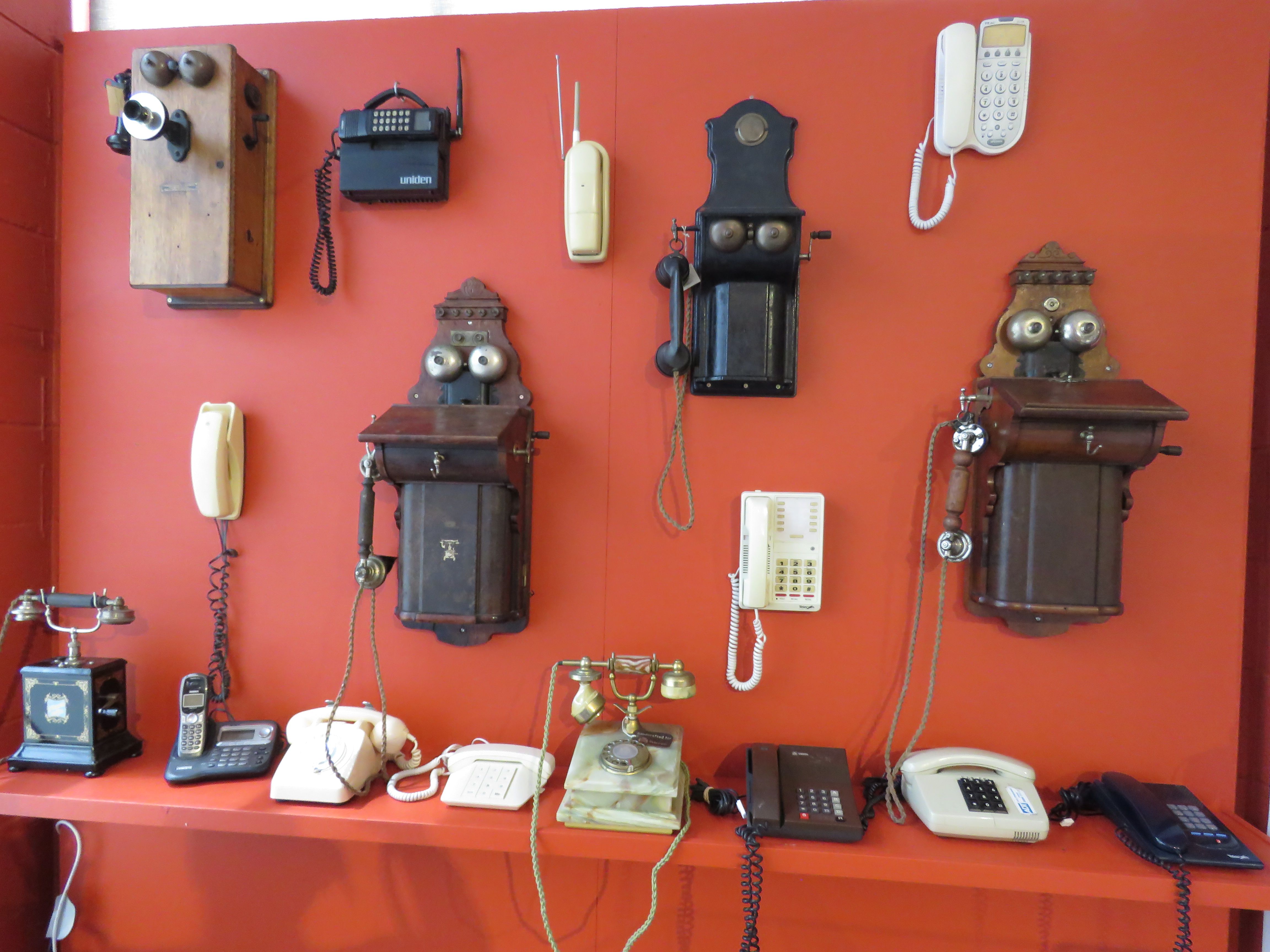 Different generations will recognise different phones on display in the museum exhibition. Photo: Merle Cave