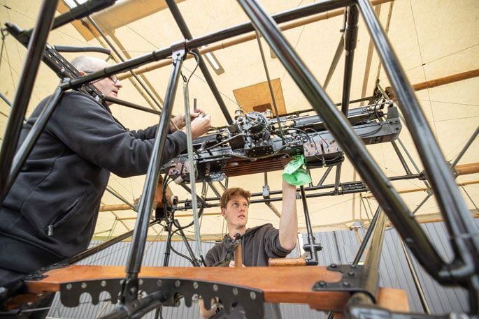 Ivan Mudrovcich with his son Joseph work on the replica. Photo: John Borren.