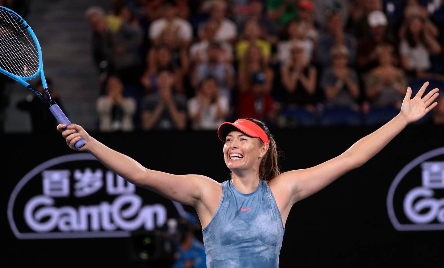 Maria Sharapova celebrates after defeating Denmark's Caroline Wozniacki in their third round match at the Australian Open tennis championships in Melbourne. Photo / AP