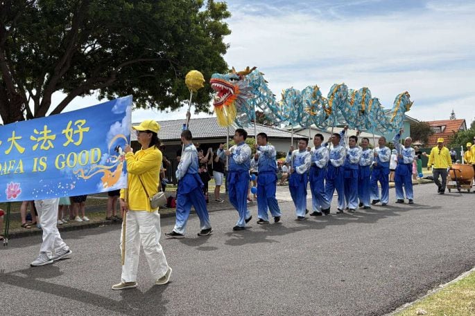 The Falun Dafa group parading in the 2024 Pak'nSave  Pāpāmoa Superhero Santa Parade. Photo / Supplied