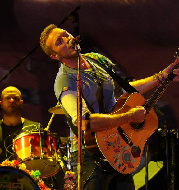 Chris Martin says he's happy to be a human 'punching bag' as