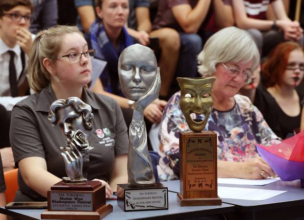 Student and Timekeeper Katelyn Stewart, left, and Jessie Bell, from Bellbird Speech and Drama, with the trophies for the winners. Photo / John Stone 