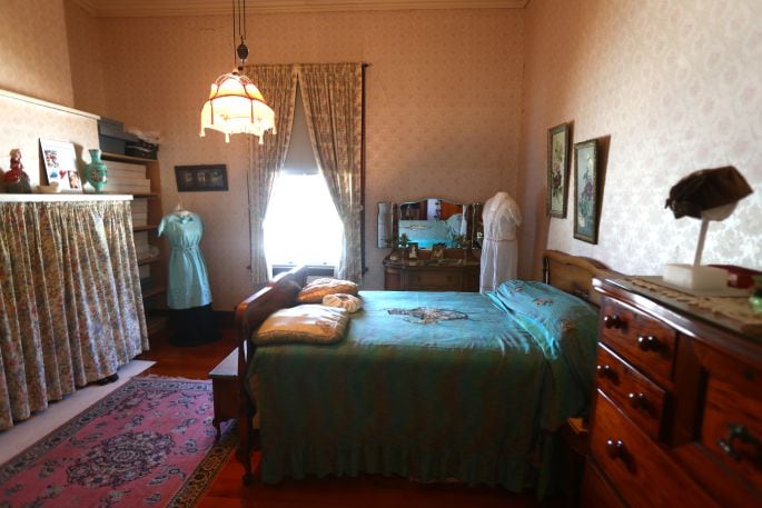 Clothing display in interior room at Brain Watkins House. Photo: John Borren.