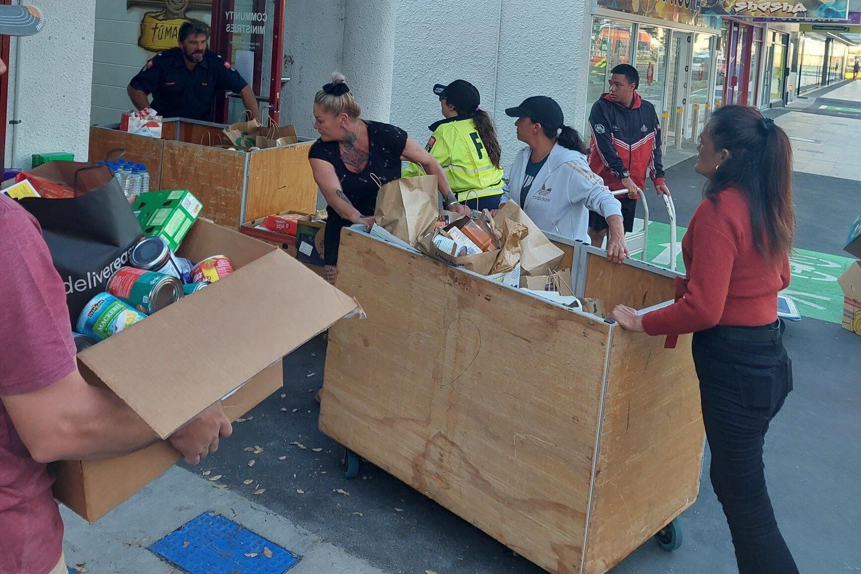 The team at the Salvation Army receive the food from the December 3 food drive.