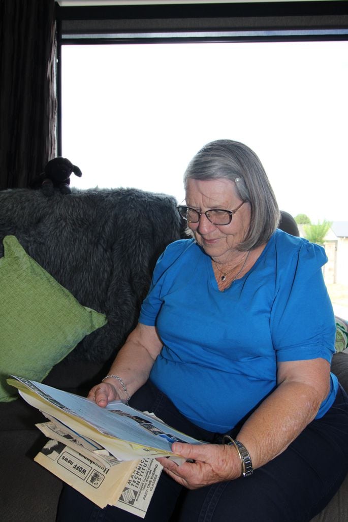 Val Williams looking over cuttings about her beloved Hunga Hunga Hall. Photo: Steve Edwards