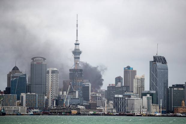 The SkyCity fire seen from Devonport. There are concerns about impacts of the contaminated water used in the fire fight on the Hauraki Gulf. Photo / Michael Craig