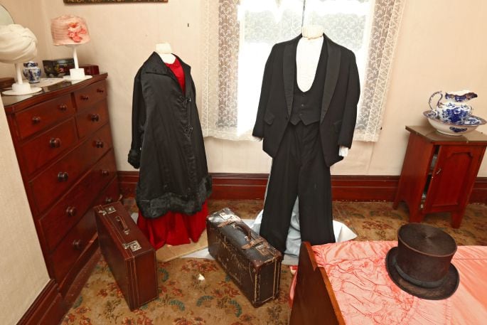 Clothing display in interior room at Brain Watkins House. Photo: John Borren.