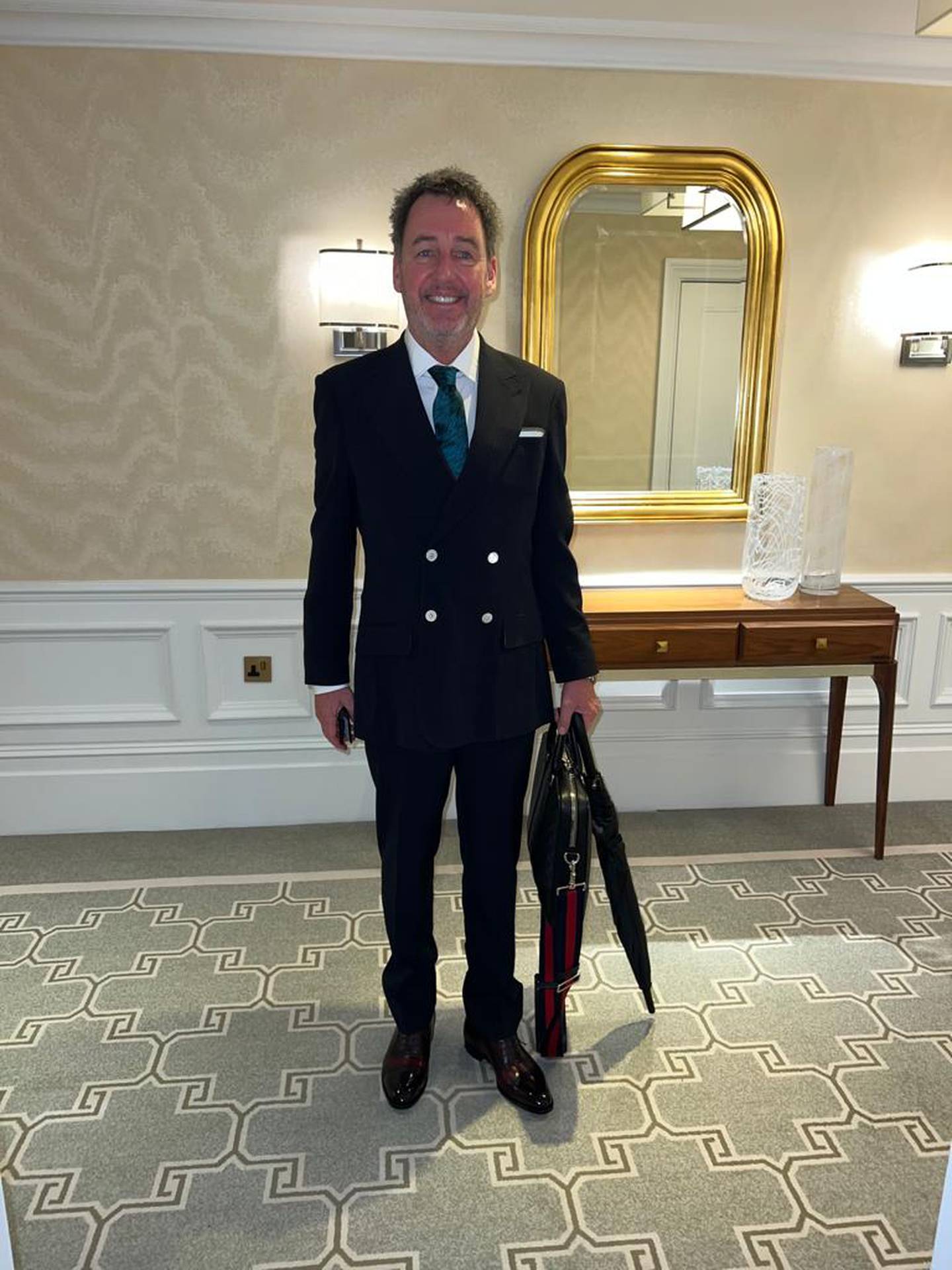 Mike Hosking in his Savile Row suit on his way to the King's Coronation at Westminster Abbey. Photo / Supplied