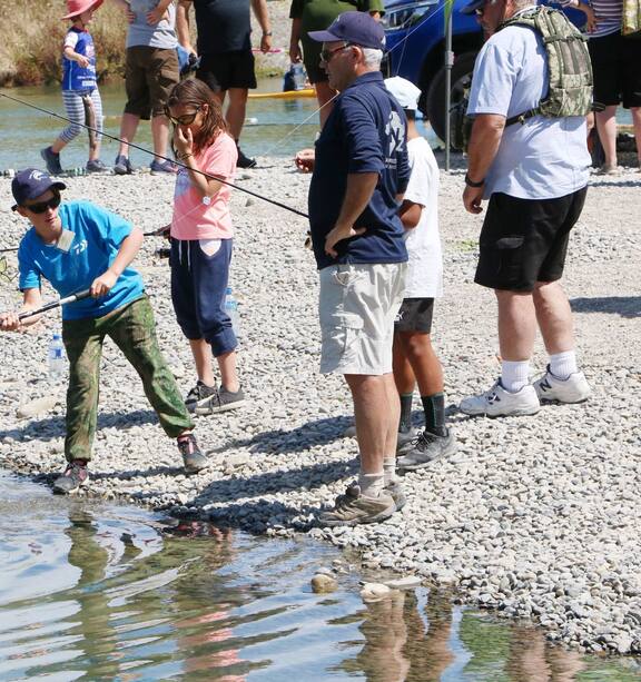 Kids tussle with hungry trout at Ōtaki's first Children's Trout