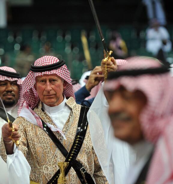 Prince Charles strikes painfully awkward figure as he takes part in Middle  Eastern knife dance - NZ Herald