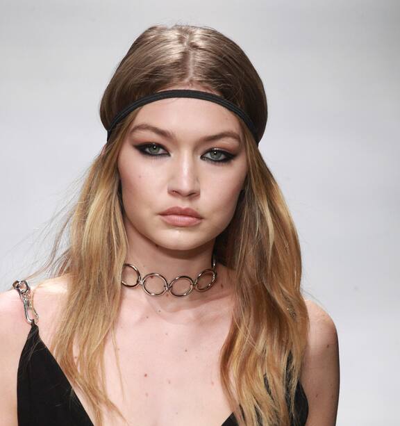 Gigi Hadid's breast pops out on the runway